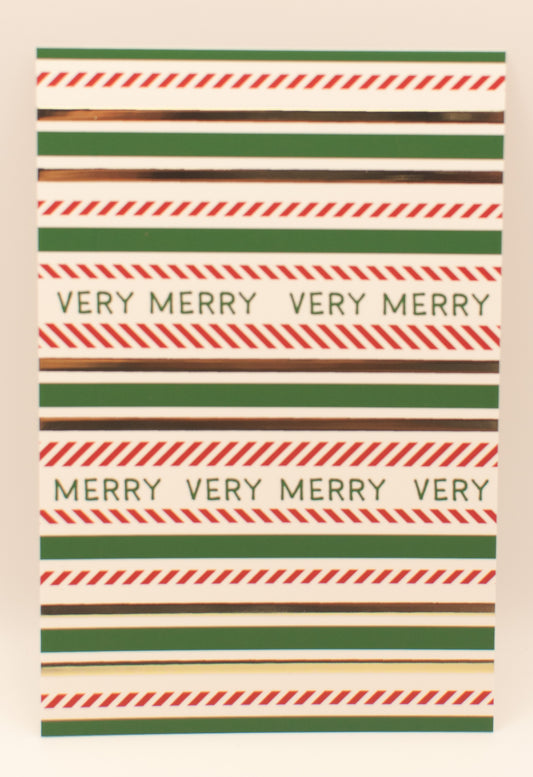 Striped paper with 'Very Merry' text in a decorative pattern
