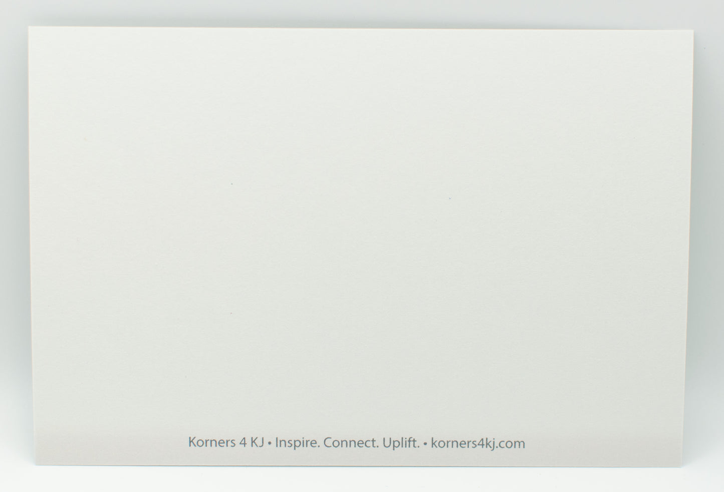 White card with text 'Korners 4 KJ' and website URL on a white background