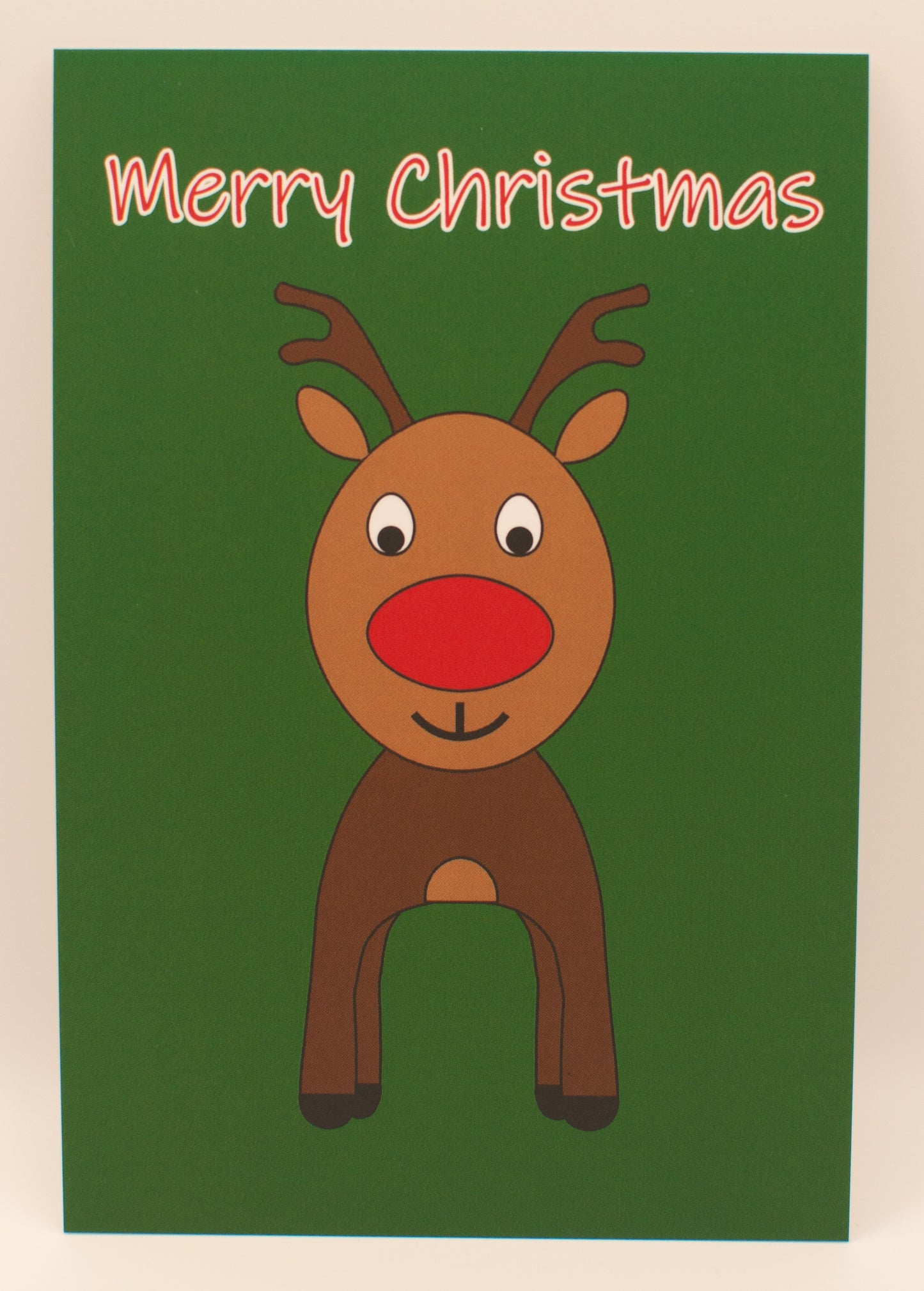 Cartoon reindeer on a green card with 'Merry Christmas' text