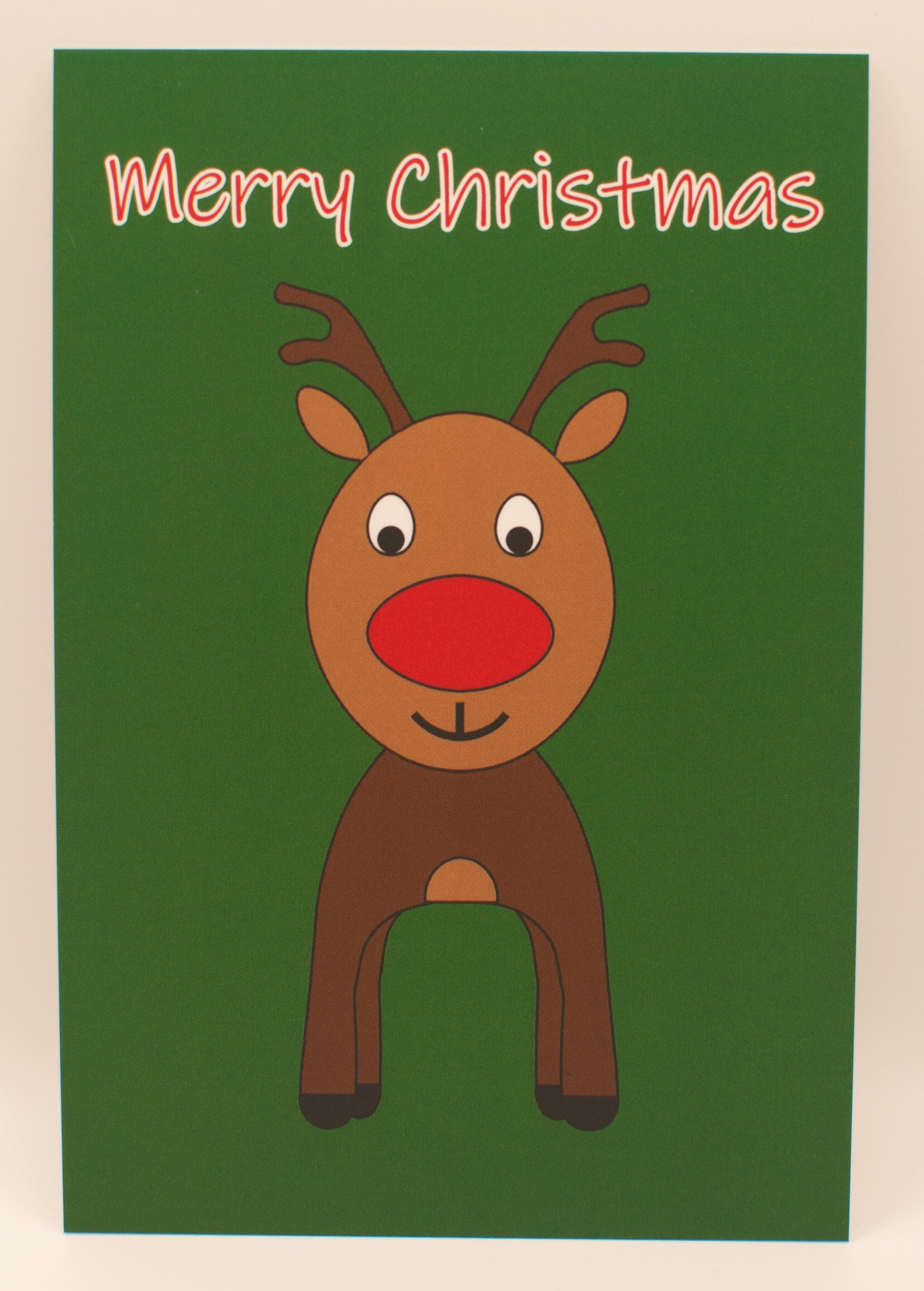 Cartoon reindeer on a green card with 'Merry Christmas' text
