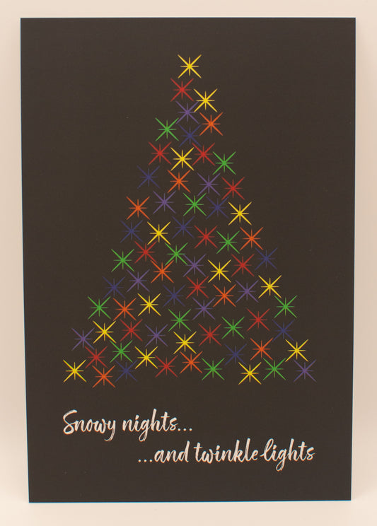Colorful Christmas tree design on a dark background with text 'Snowy nights...and twinkle lights'.