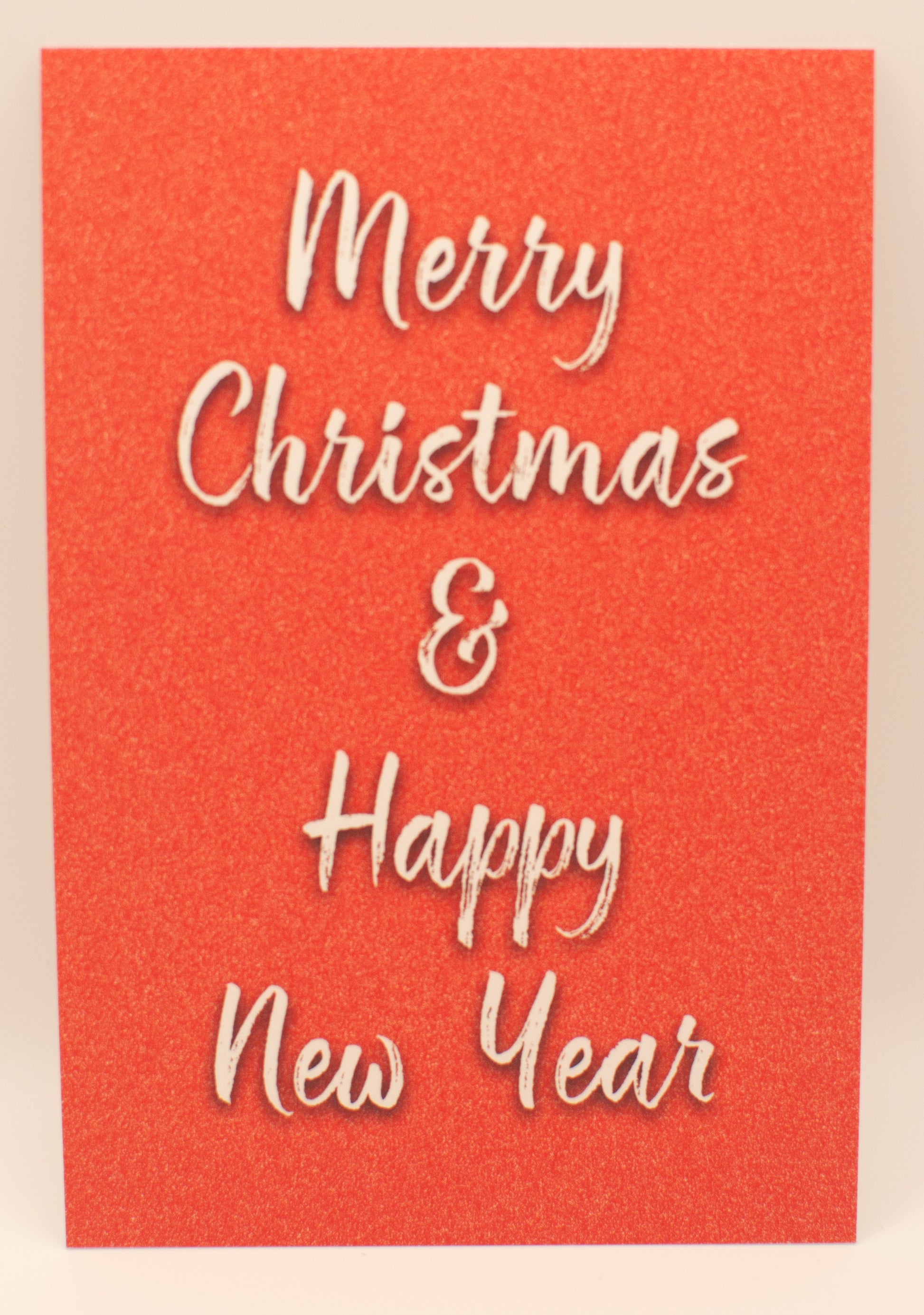 Red card with 'Merry Christmas & Happy New Year' text