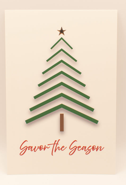 Green Christmas tree with a star on top and 'Savor the Season' text on a beige background