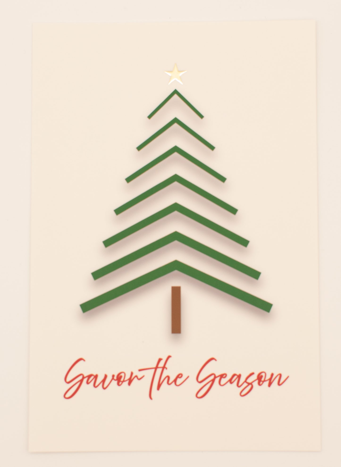 Green Christmas tree design on a beige background with 'Savor the Season' text.
