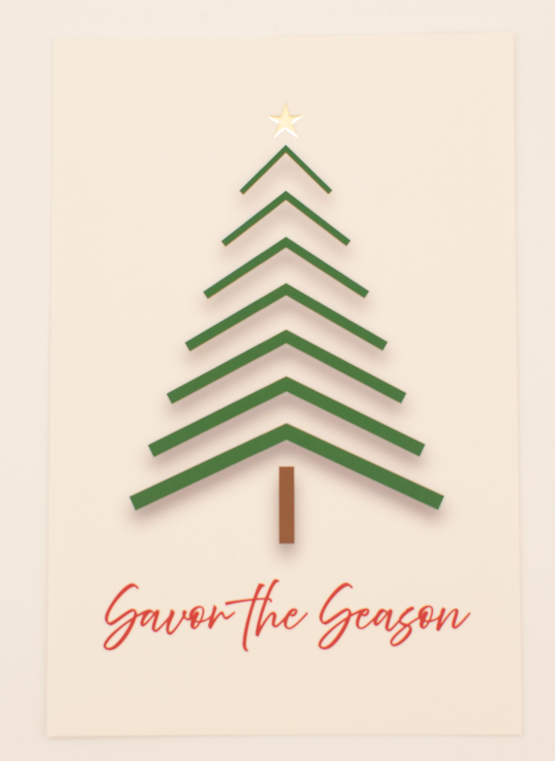 Green Christmas tree design on a beige background with 'Savor the Season' text.